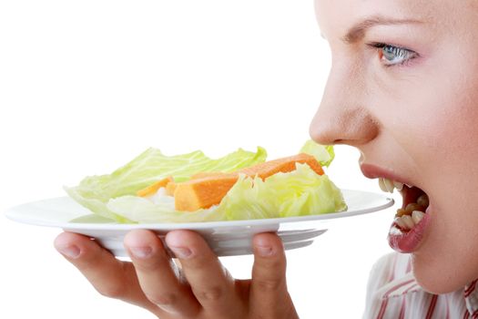 Female eating her salad isolated on white background