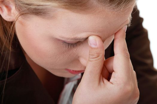 Woman with severe Migraine Headache holding hands to head