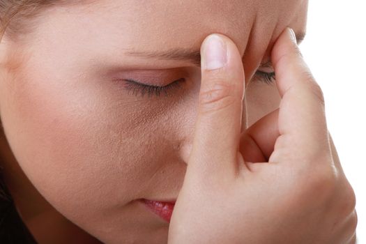 Woman with severe Migraine Headache holding hands to head