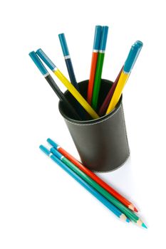 Colored Pencils in a cup holder isolated against a white background