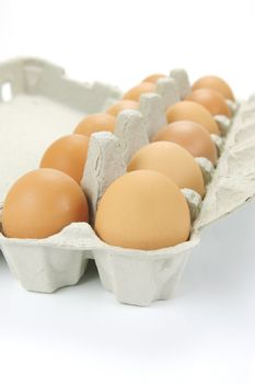 Free range eggs isolated against a white background