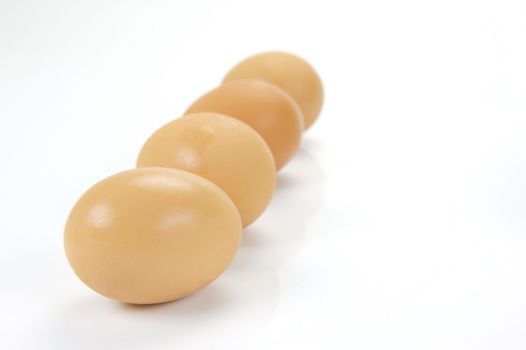 Free range eggs isolated against a white background