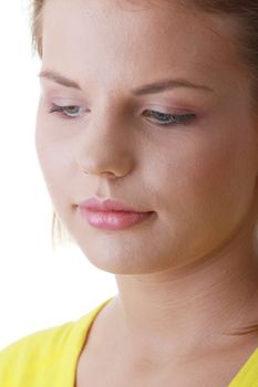 Closeup portrait of a sad young woman isolated on white
