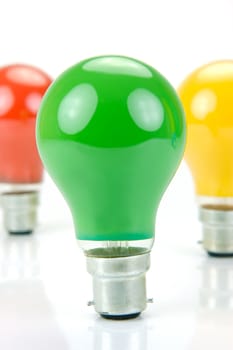 Colored light bulbs isolated against a white background