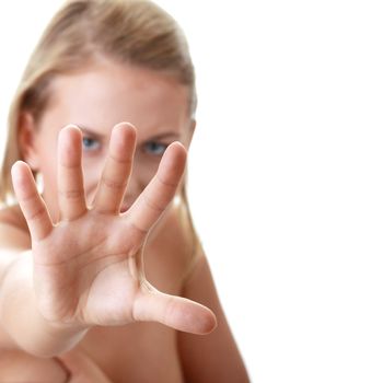 Scared nude woman defend herself from somebody striking out at her - fear concept