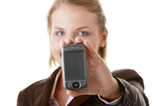 Attractive business woman smiling while using a pda. Isolated on white.