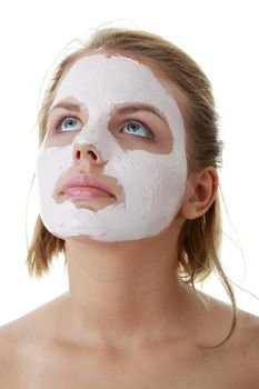 Cosmetics mask of clay on the young female face