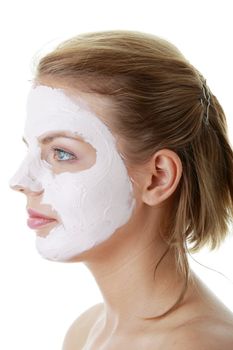 Cosmetics mask of clay on the young female face