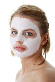 Cosmetics mask of clay on the young female face