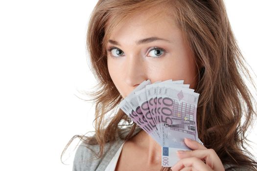 Happy young woman holding money isolated on white