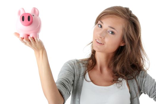 Young beautiful woman standing with piggy bank (money box), isolated on white background