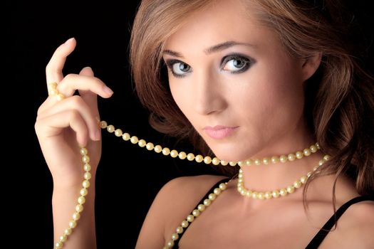 The dreaming woman with a pearl necklace