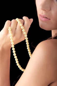 The dreaming woman with a pearl necklace