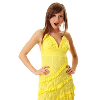 Beautiful brunette girl in yellow dress. Isolated on white background