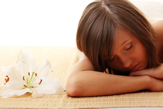 Young woman (teen girl) relaxing in massage