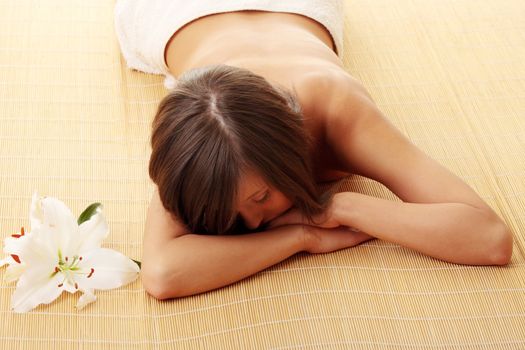 Young woman (teen girl) relaxing in massage