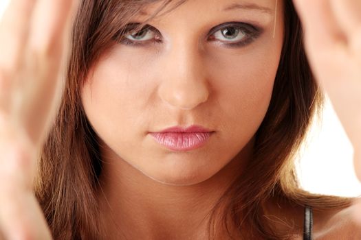 Closeup of beautiful teen making frame with her hands