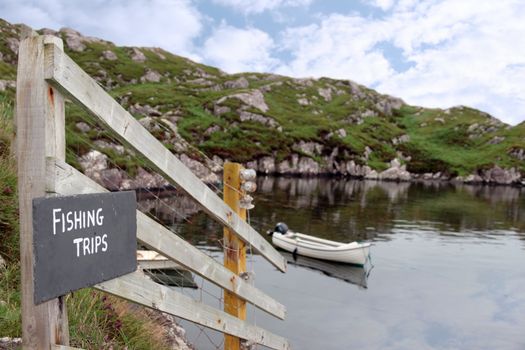 fishing trips sign at a bay with scenic view in county kerry ireland