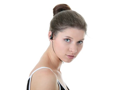 Young fitness woman with sport headphones listening music