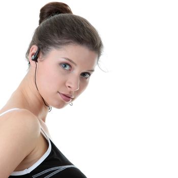 Young fitness woman with sport headphones listening music