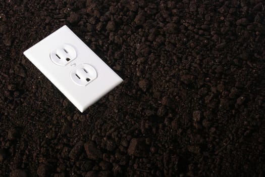 The electric socket against a ground - a symbol of an alternative energy source.