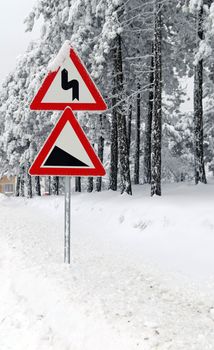 Traffic road sign in frost and snow