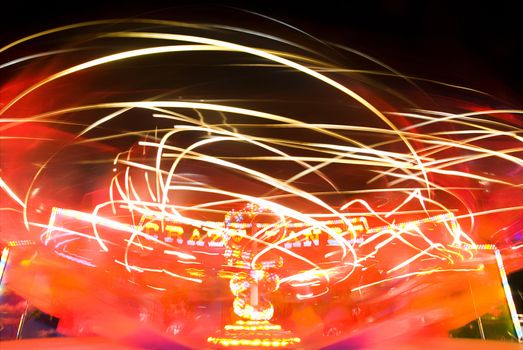 Blur neon lights in amusement park, long exposure