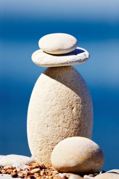 Round pebbles on top of a long cobblestone