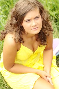 Beautiful young woman relaxing at park