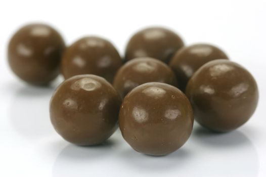 Chocolate balls isolated against a white background