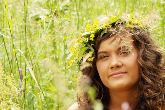 Portrait of a beautiful girl in the wreath
