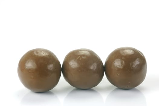 Chocolate balls isolated against a white background