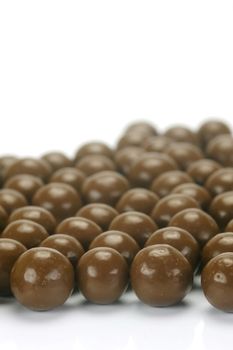 Chocolate balls isolated against a white background