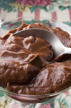 Chocolate pudding in glass with spoon