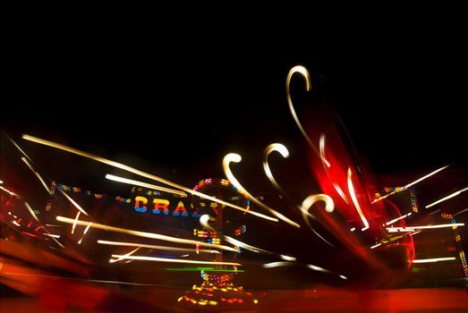 Blur neon lights in amusement park, long exposure