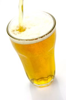 Glasses of beer isolated against a white background