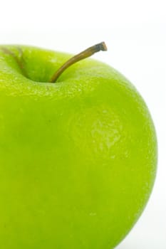 A rgreen apple isolated against a white background