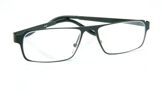 A pair of reading glasses isolated against a white background