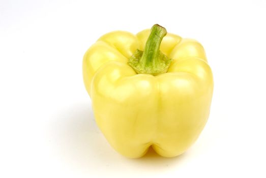 One yellow pepper isolated on white