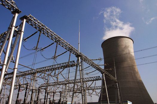 View of the high voltage transmission lines in a heat power plant