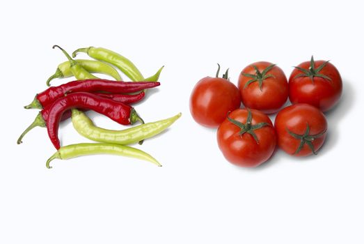 Peppers and tomatoes on white background