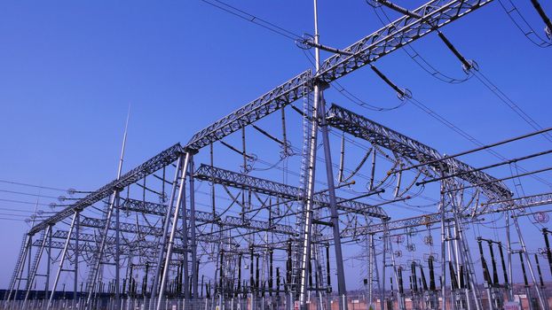 View of the high voltage transmission lines in a heat power plant