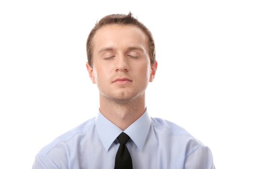 Businessman sitting in lotus position, Isolated against white background