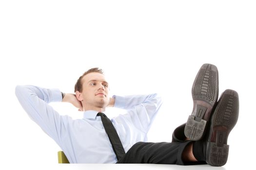 Businessman sitting at desk, isolated