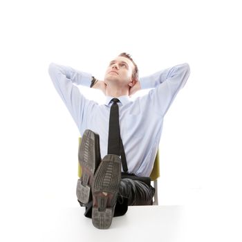 Businessman sitting at desk, isolated