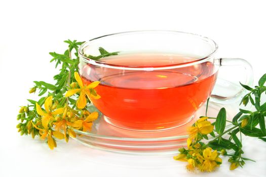 a cup of St. John's Wort Tea with fresh flowers