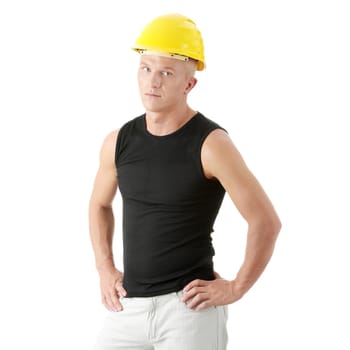 Young handsome builder in yellow helmet. Isolated over white background