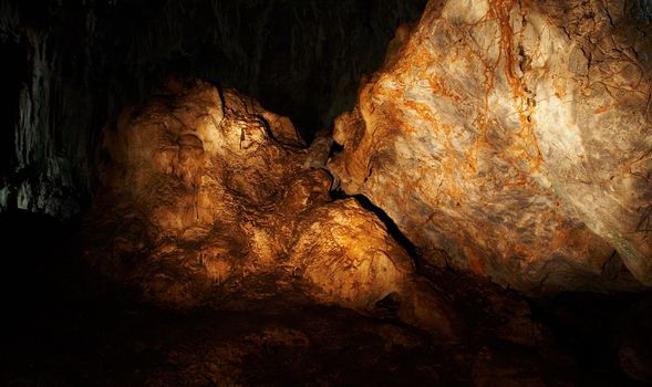 The amber rock in a cave (light painting)