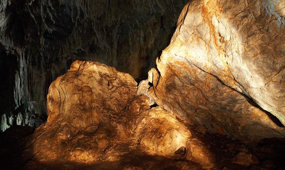 The amber rock in a cave (light painting)