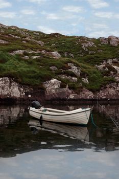 fishing boat at a bay with scenic view in county kerry ireland